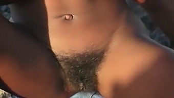 African-American Woman Indulges In Outdoor Pleasure